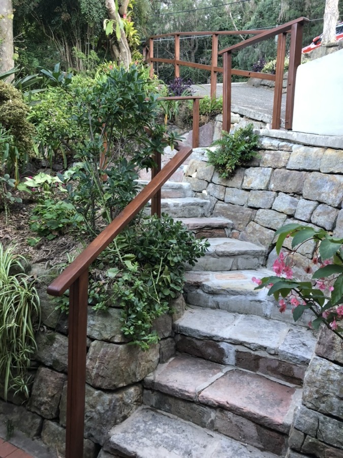 Timber handrail on sandstone steps — Mona Vale